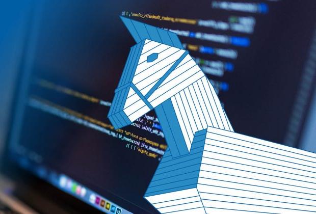 A graphic of a wooden Trojan horse in front of a computer screen displaying computer code